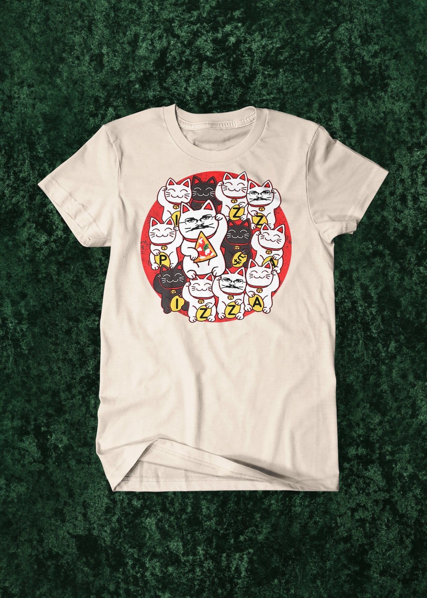 Light beige t-shirt with a graphic design of lucky cat-style cats with some Pizza John faces on a green textured background